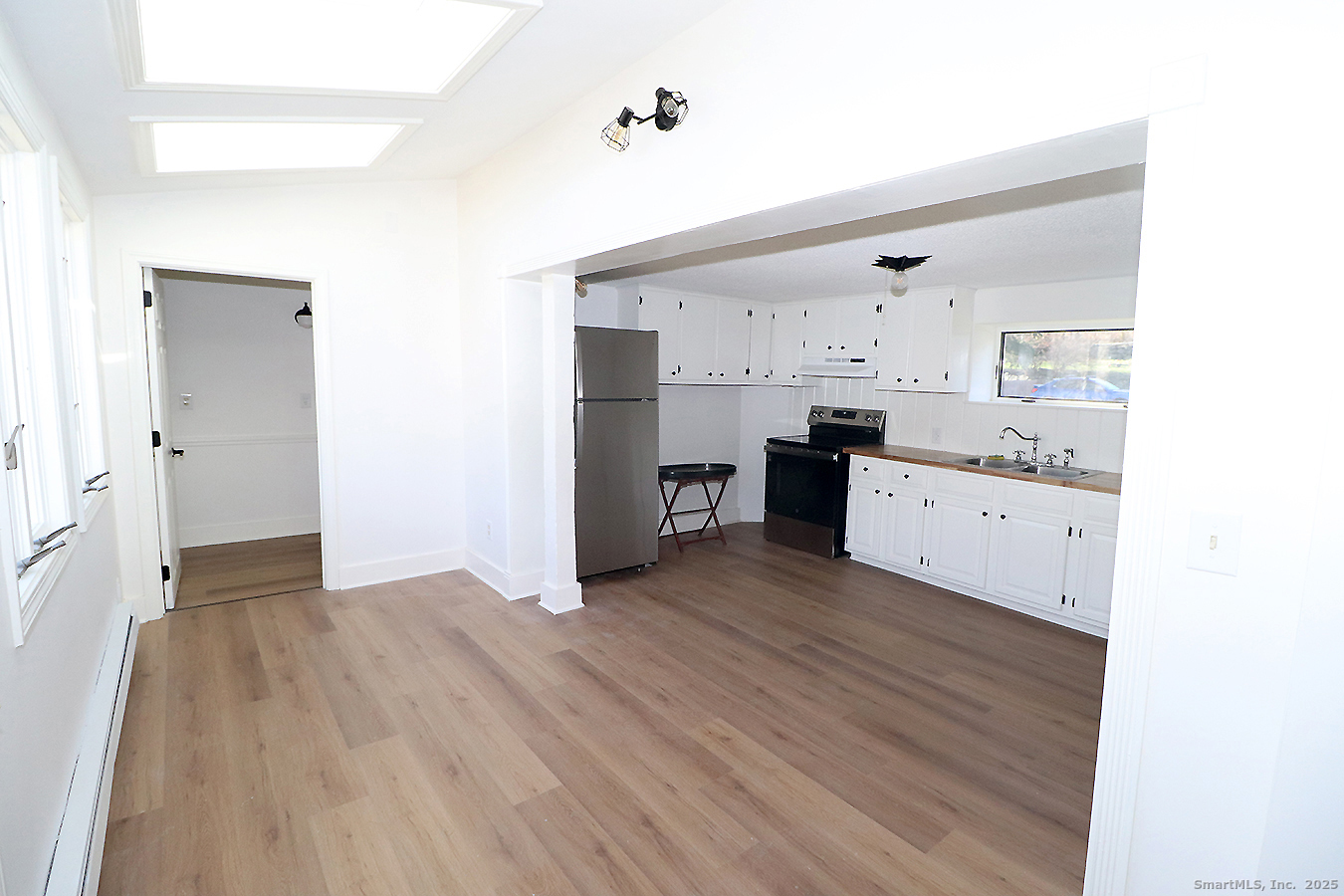 9 John Street Winchester, CT 06098 - Photo 9 of 23 a view of a kitchen with wooden floor