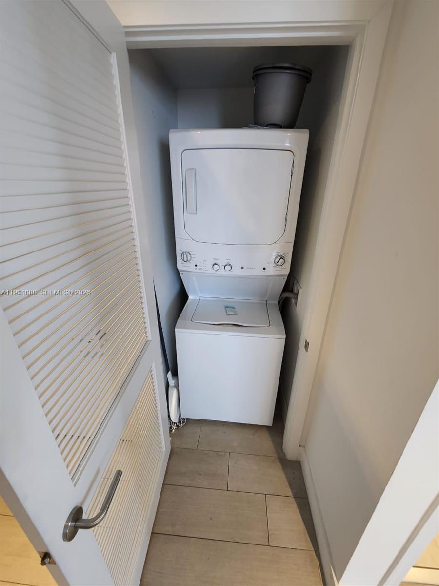 4010 South Ocean Drive, Unit R1709 Hollywood, FL 33019 - Photo 15 of 16 a utility room with a washer and dryer