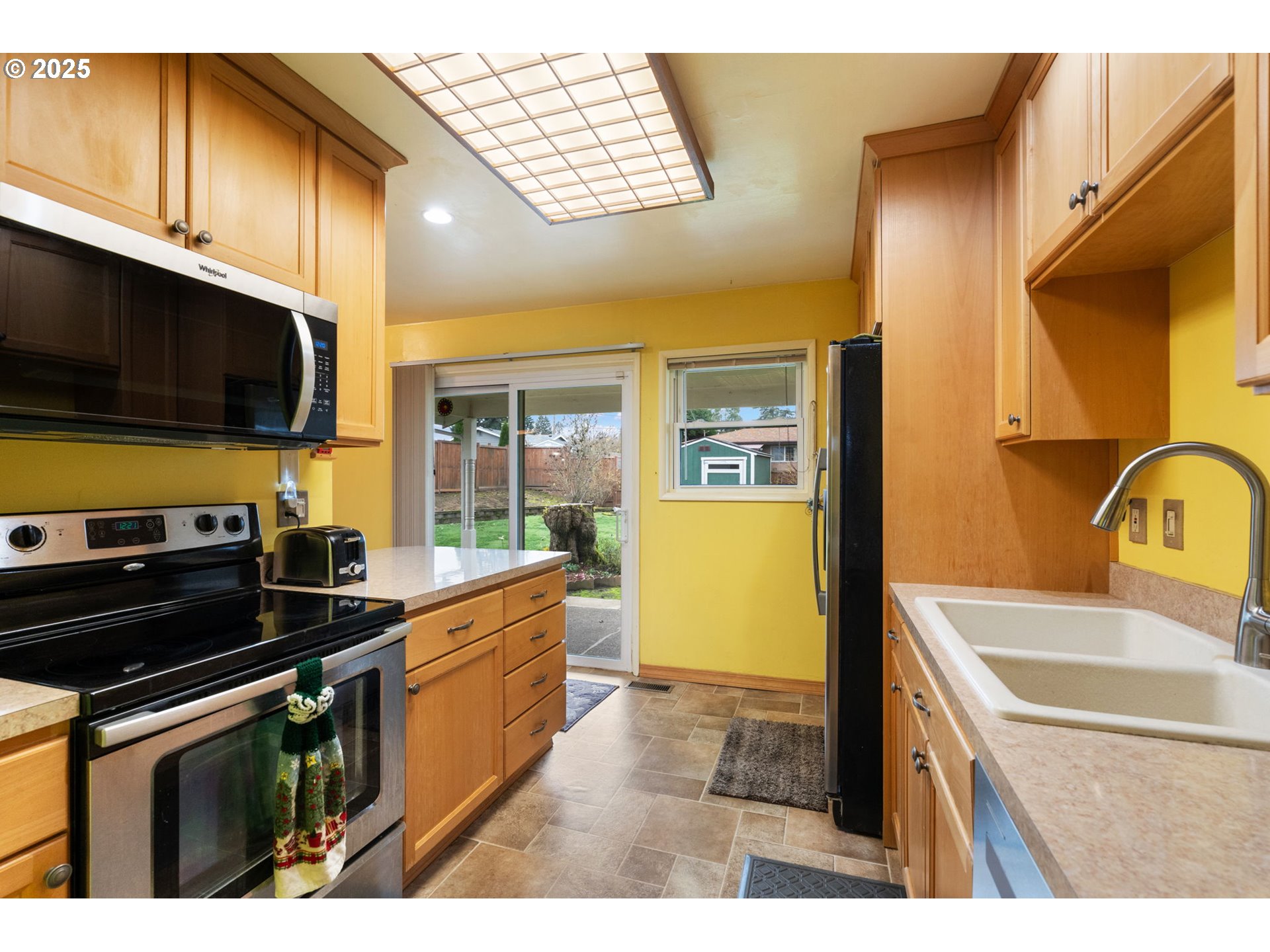 2707 Northeast 123rd Avenue Portland, OR 97230 - Photo 11 of 25 a kitchen with a sink and cabinets