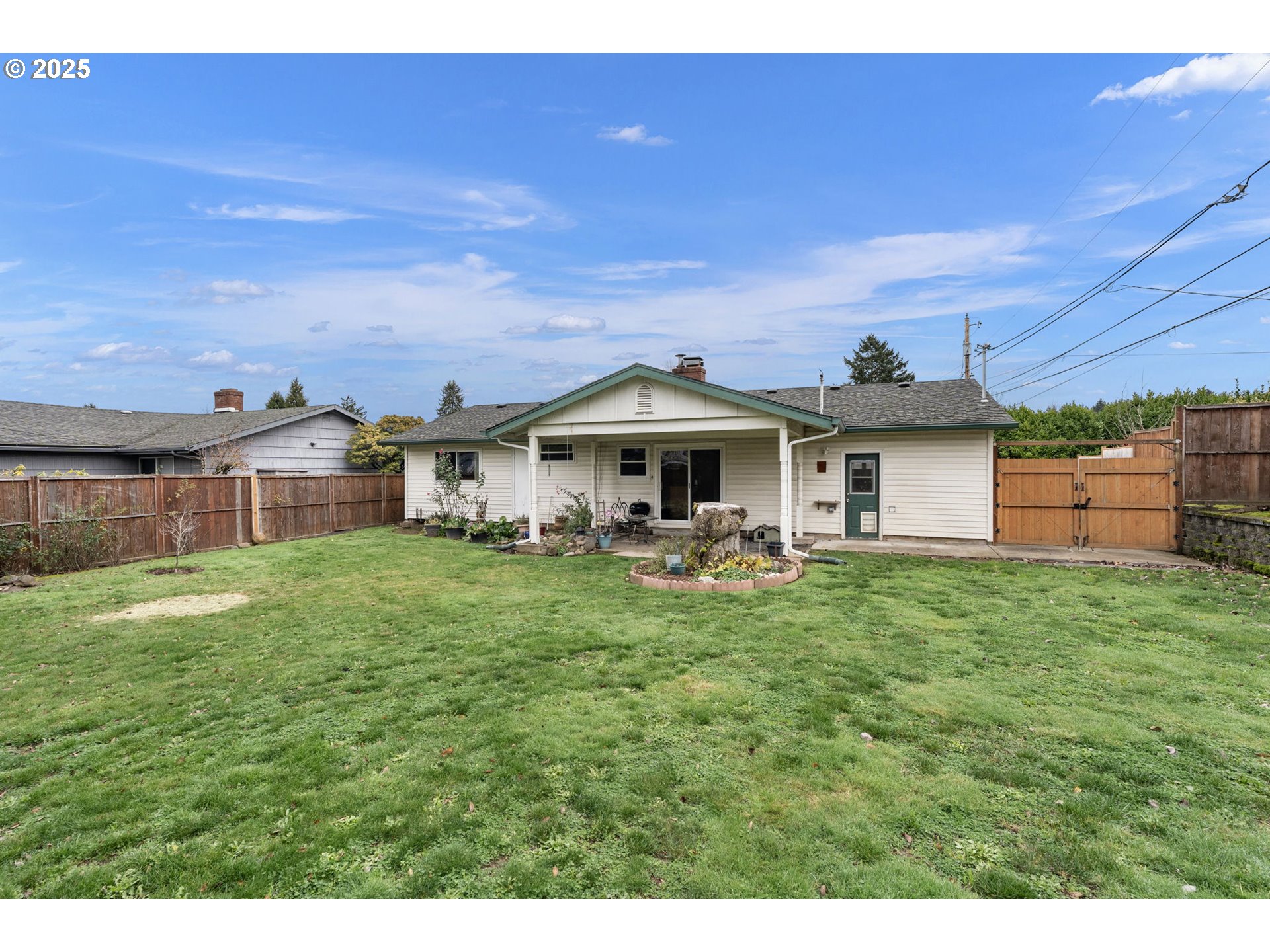 2707 Northeast 123rd Avenue Portland, OR 97230 - Photo 21 of 25 a front view of a house with a garden