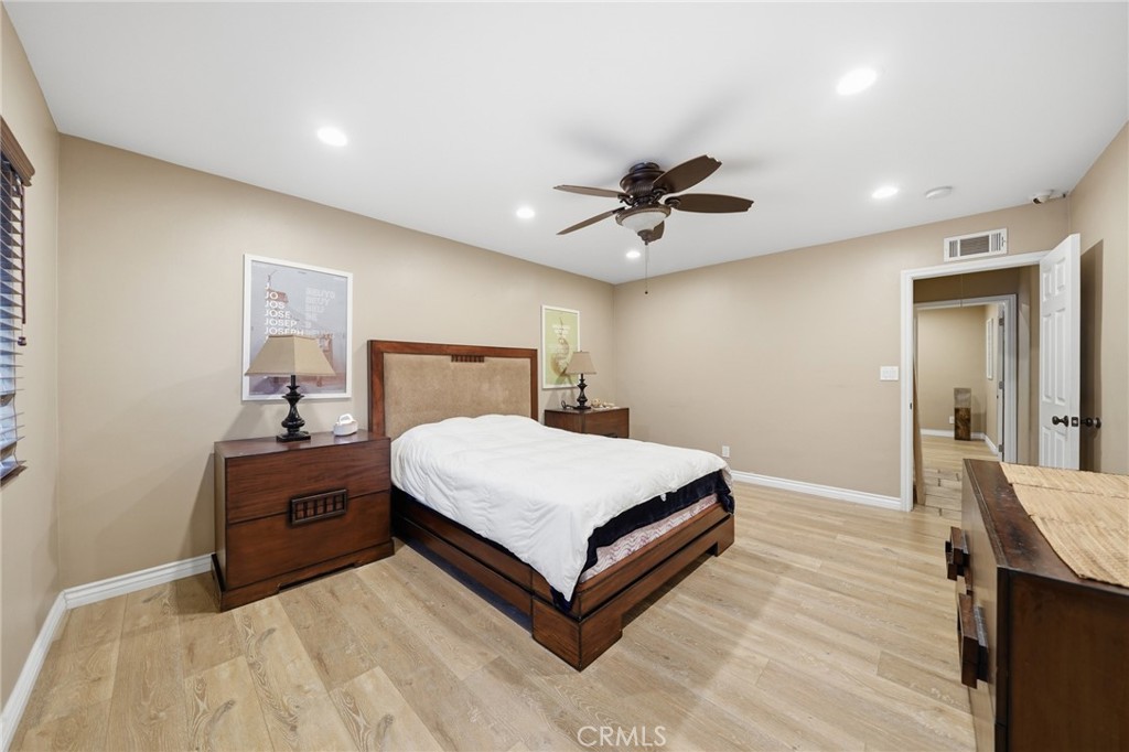706 Nancy Lane Fullerton, CA 92831 - Photo 11 of 56 a bedroom with a bed and a chandelier