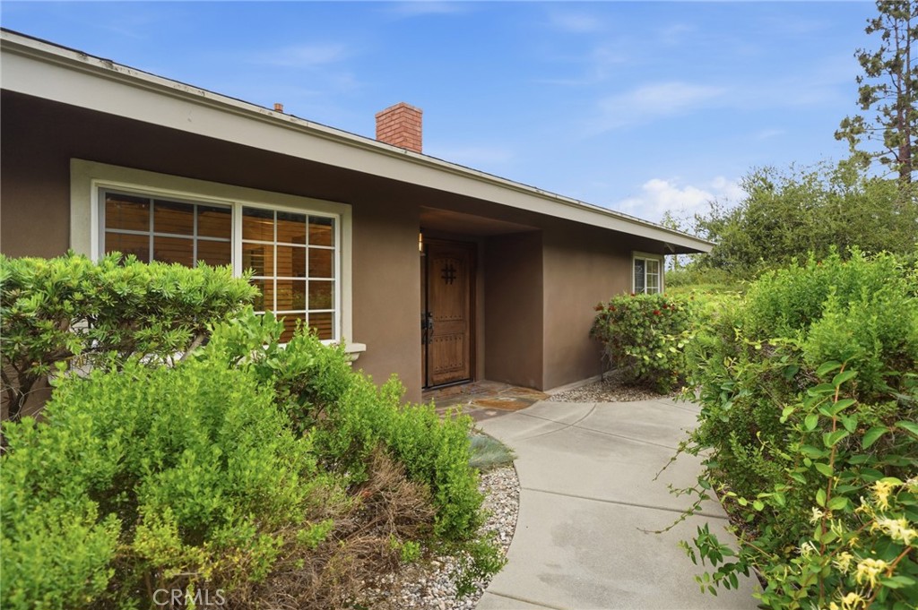 706 Nancy Lane Fullerton, CA 92831 - Photo 2 of 56 front view of a house with potted plants