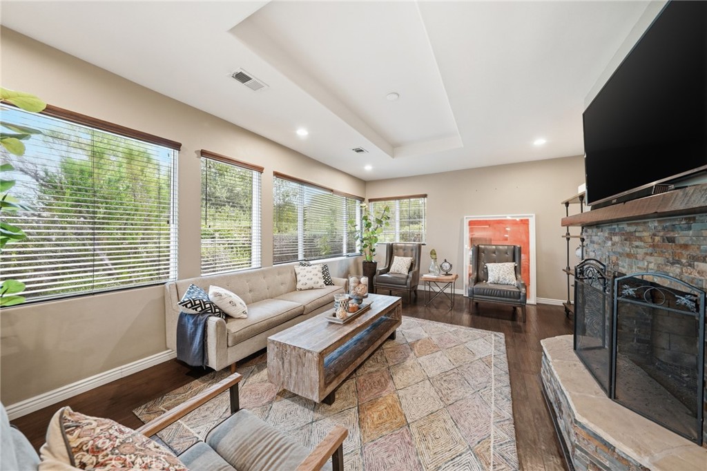 706 Nancy Lane Fullerton, CA 92831 - Photo 21 of 56 a living room with furniture a flat screen tv and a fireplace
