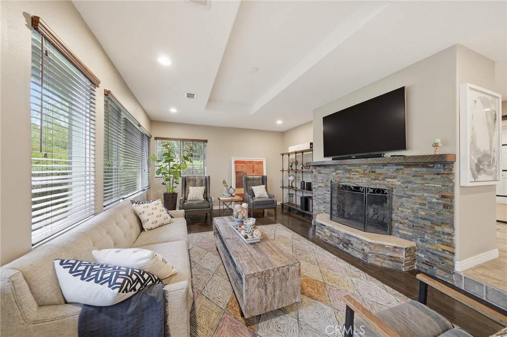706 Nancy Lane Fullerton, CA 92831 - Photo 22 of 56 a living room with furniture a fireplace and a flat screen tv