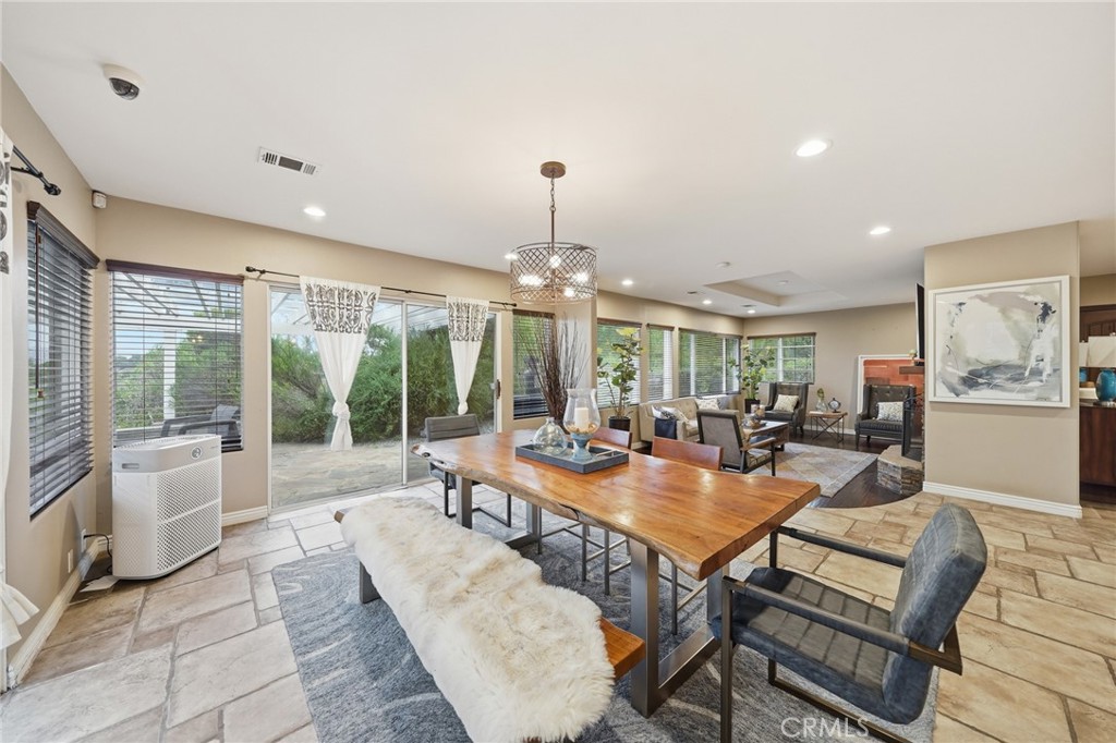 706 Nancy Lane Fullerton, CA 92831 - Photo 29 of 56 a view of a dining room with furniture wooden floor and chandelier
