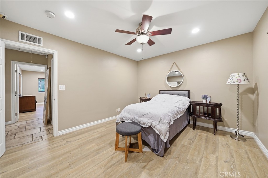 706 Nancy Lane Fullerton, CA 92831 - Photo 8 of 56 a bedroom with a bed and a chandelier