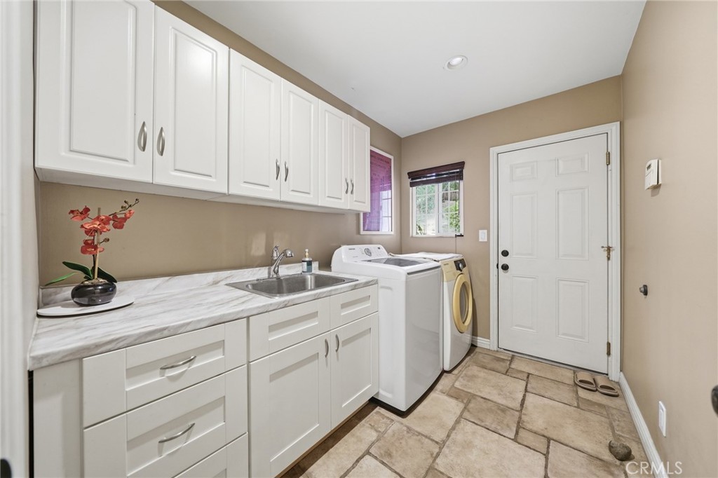 706 Nancy Lane Fullerton, CA 92831 - Photo 9 of 56 a utility room with cabinets washer and dryer