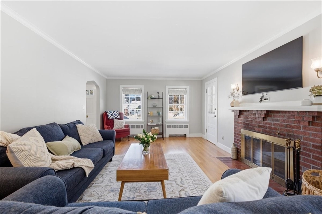 46 Park Street Dedham, MA 02026 - Photo 5 of 35 a living room with furniture and a flat screen tv