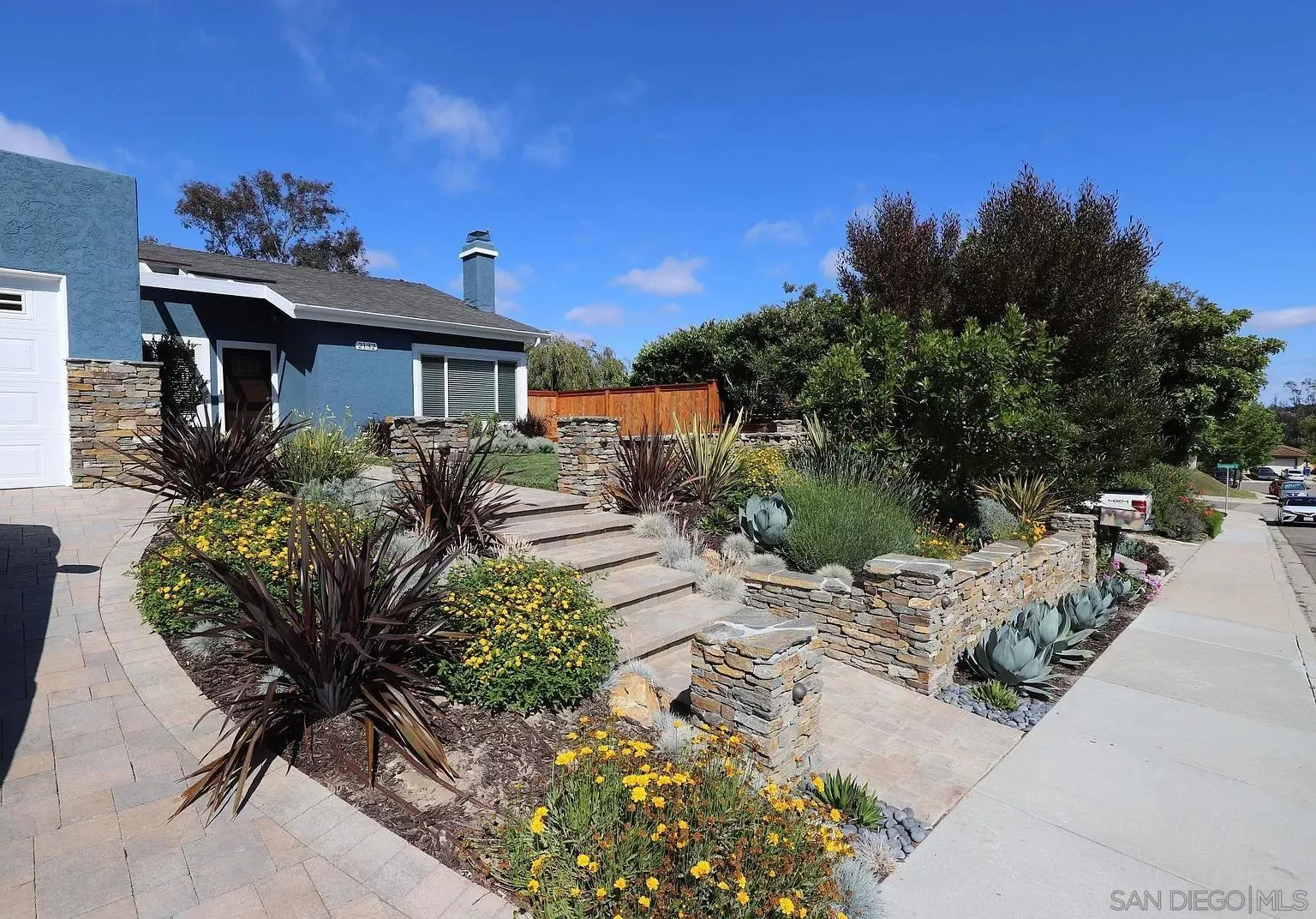 2132 Pleasant Grove Road Encinitas, CA 92024 - Photo 1 of 21 a house with a yard and a wooden fence
