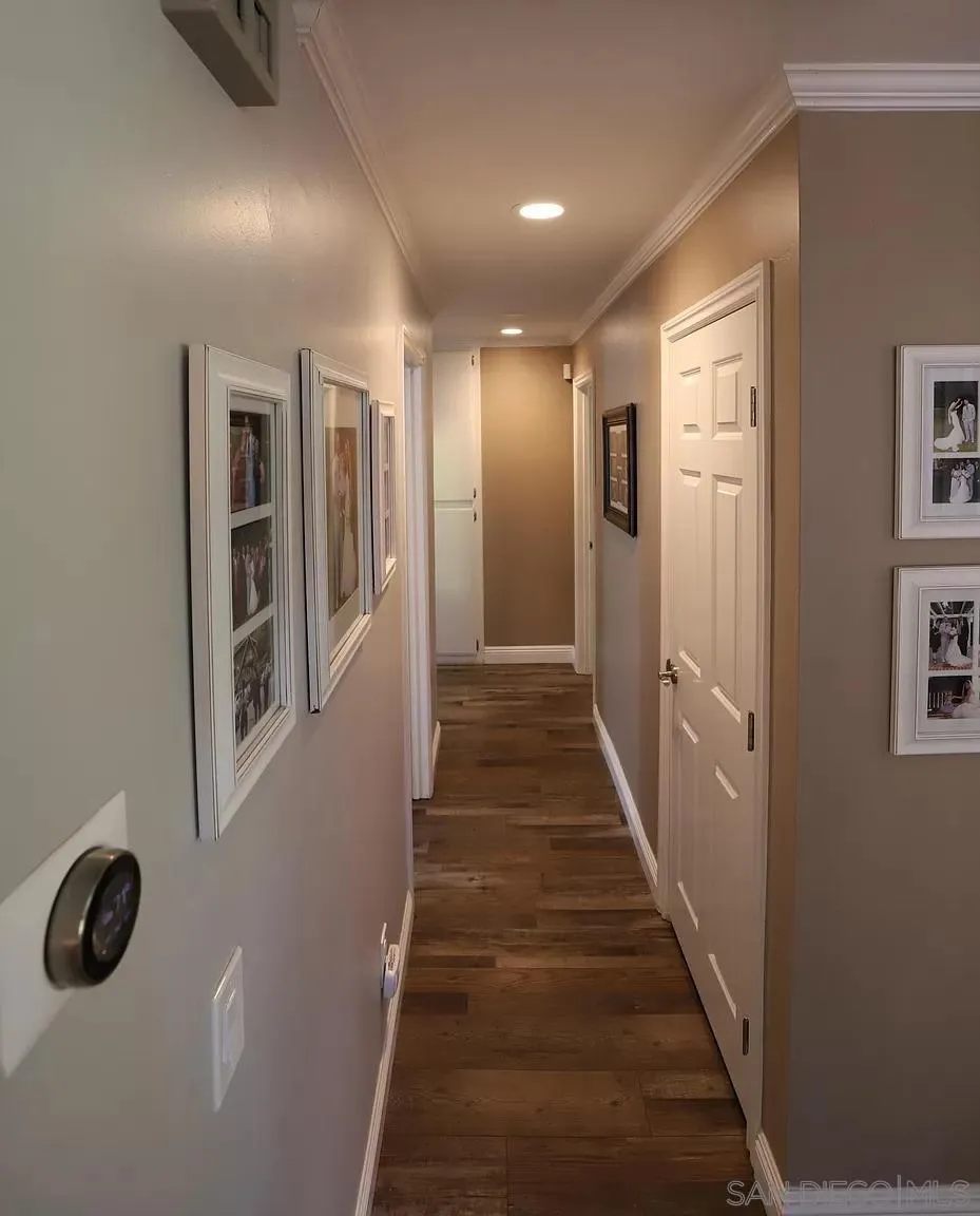 2132 Pleasant Grove Road Encinitas, CA 92024 - Photo 11 of 21 a view of a hallway with wooden floor and staircase