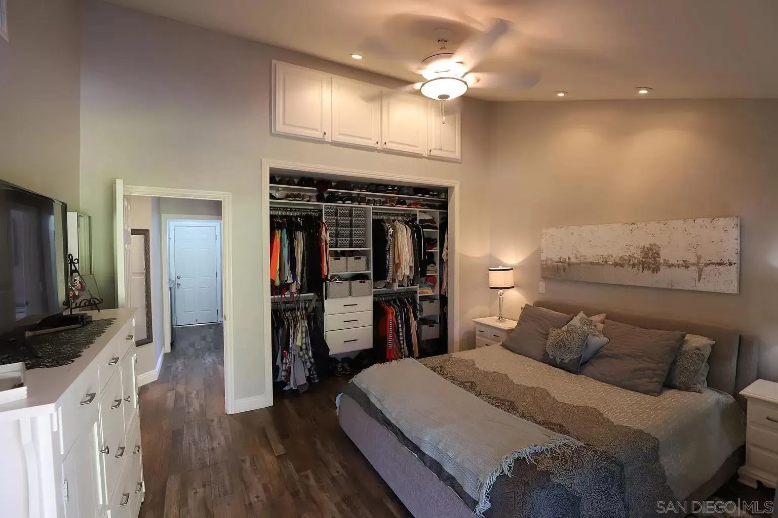 2132 Pleasant Grove Road Encinitas, CA 92024 - Photo 16 of 21 a bedroom with a bed and a flat tv screen on the dresser