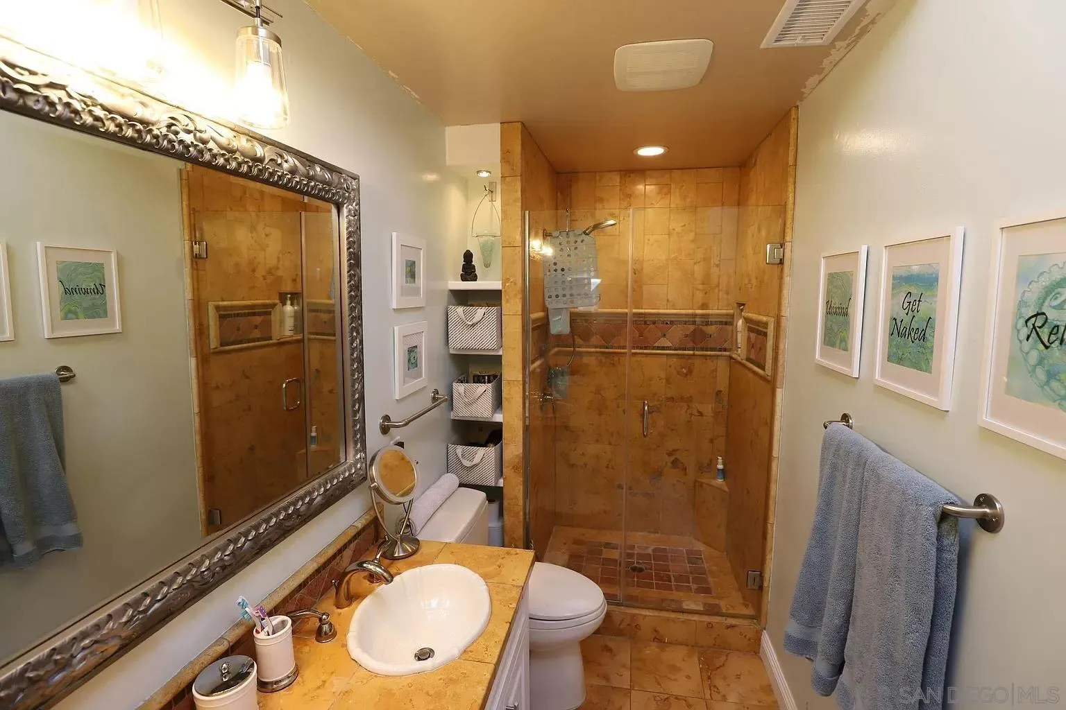 2132 Pleasant Grove Road Encinitas, CA 92024 - Photo 17 of 21 a bathroom with a granite countertop sink toilet and shower