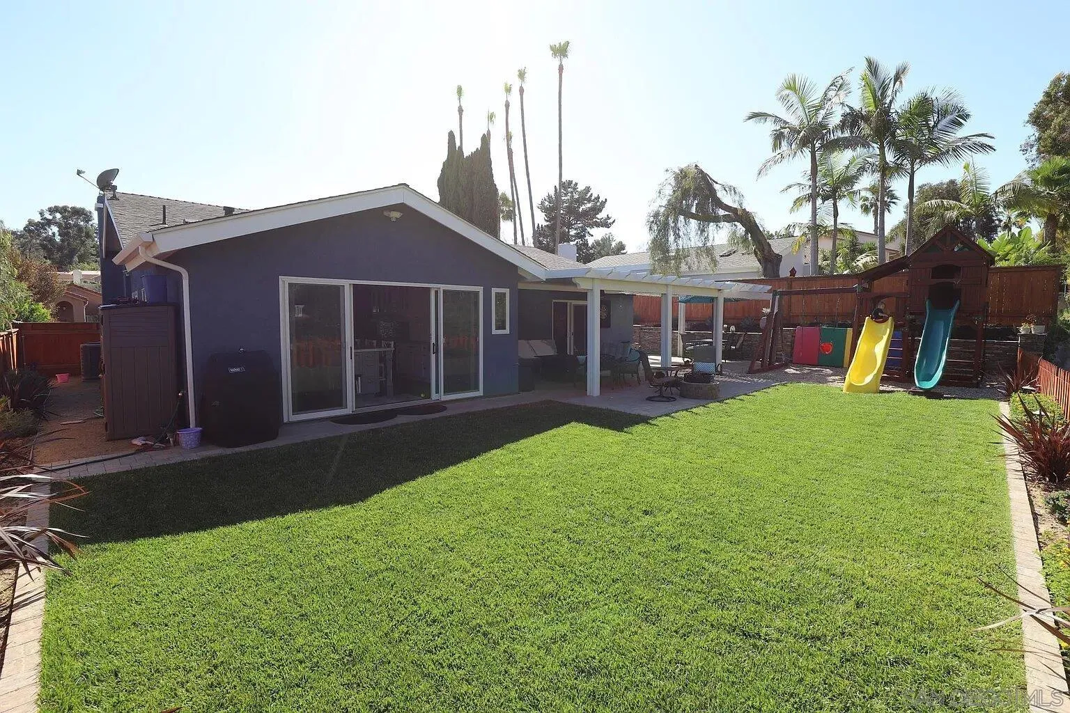 2132 Pleasant Grove Road Encinitas, CA 92024 - Photo 21 of 21 a view of a house with a yard and a large tree