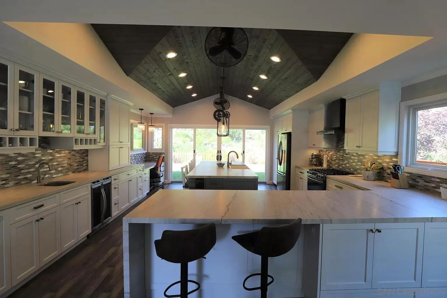 2132 Pleasant Grove Road Encinitas, CA 92024 - Photo 7 of 21 a kitchen with counter space dining table and chairs