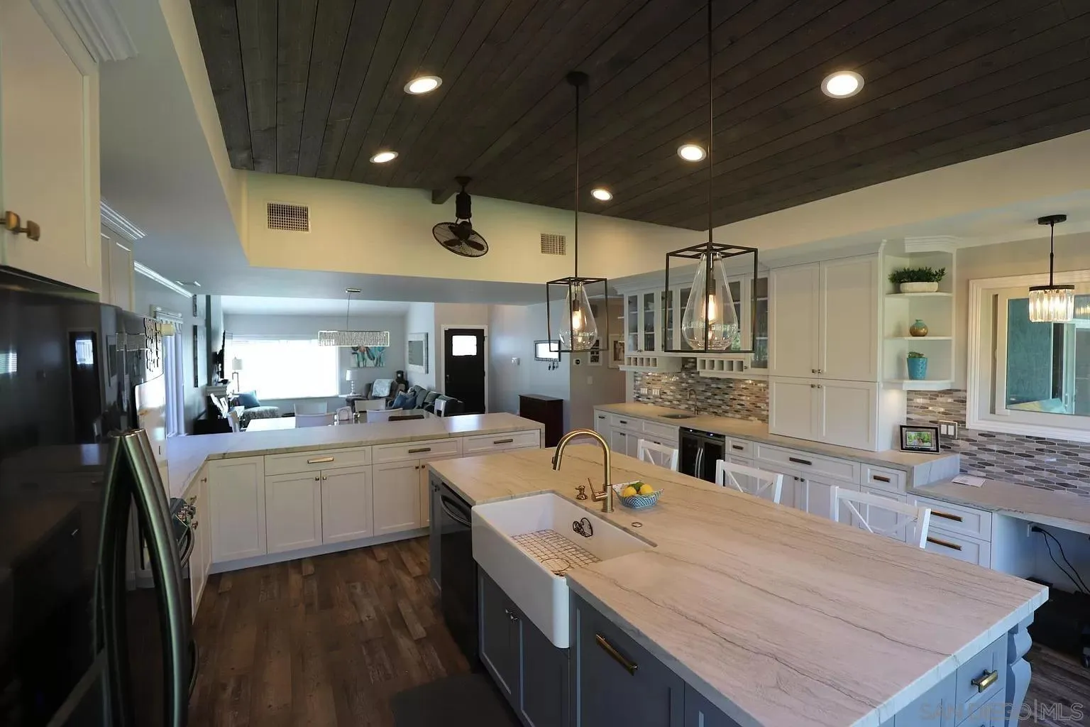 2132 Pleasant Grove Road Encinitas, CA 92024 - Photo 9 of 21 a kitchen with stainless steel appliances kitchen island granite countertop a sink and cabinets