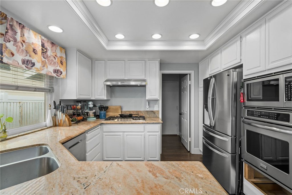 5810 Greens Drive Riverside, CA 92509 - Photo 14 of 31 a kitchen with stainless steel appliances granite countertop a sink stove and refrigerator