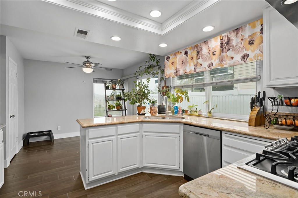 5810 Greens Drive Riverside, CA 92509 - Photo 16 of 31 a kitchen with a sink and cabinets
