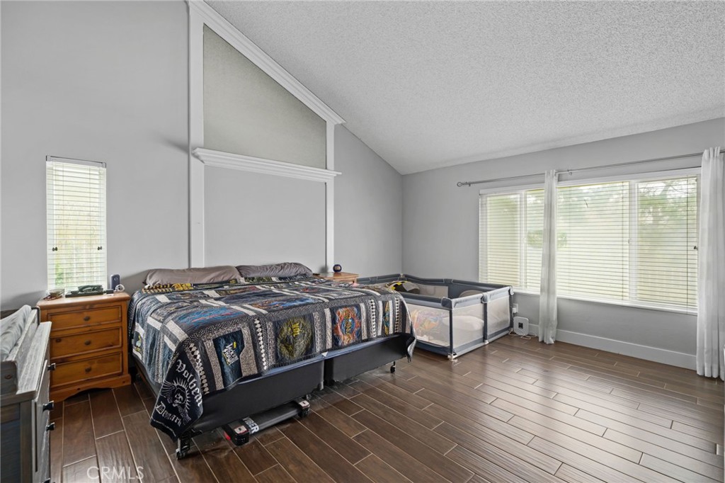 5810 Greens Drive Riverside, CA 92509 - Photo 19 of 31 a bedroom with a bed and a large window