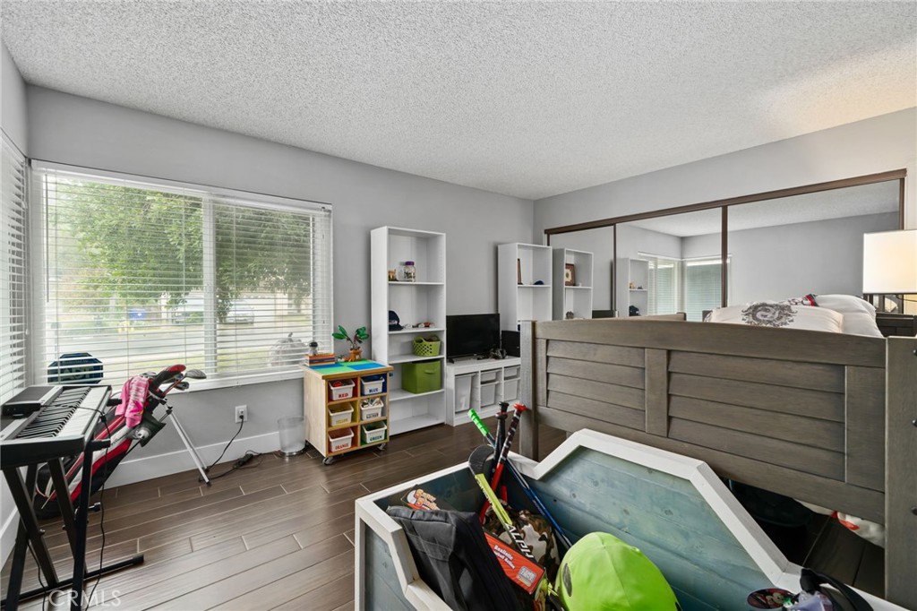 5810 Greens Drive Riverside, CA 92509 - Photo 23 of 31 a bedroom with furniture and a large window
