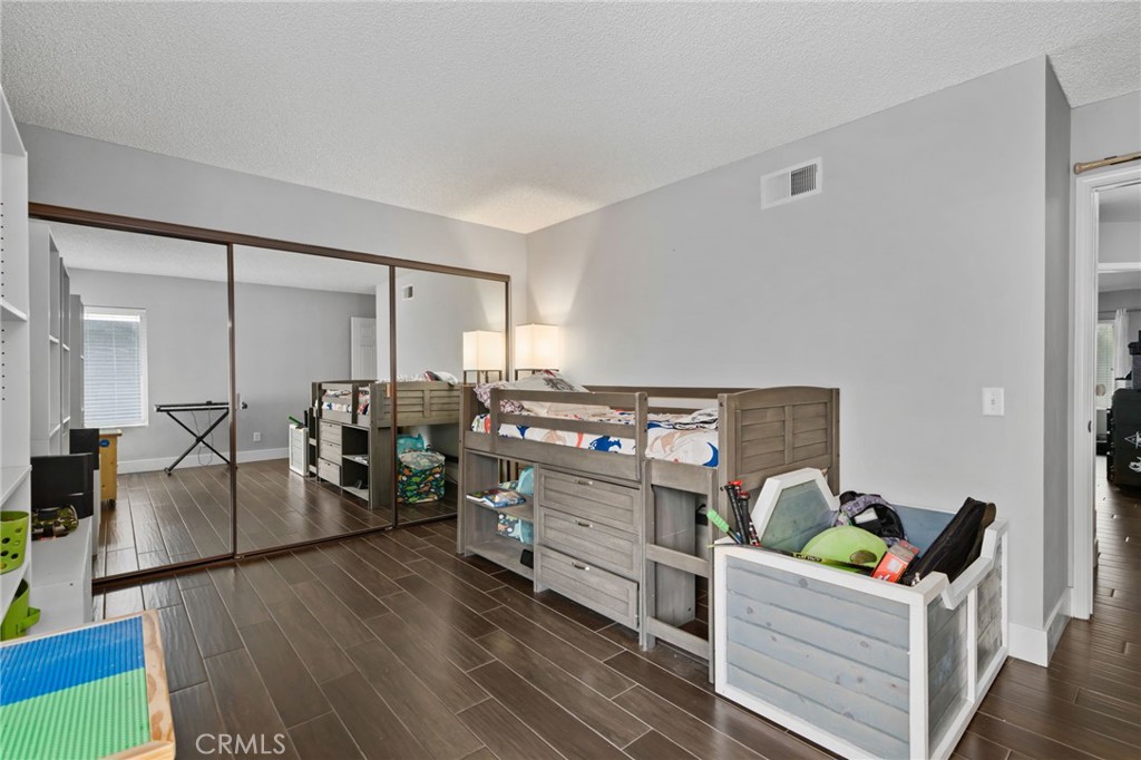 5810 Greens Drive Riverside, CA 92509 - Photo 24 of 31 a living room with furniture and wooden floor