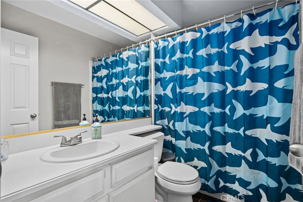 5810 Greens Drive Riverside, CA 92509 - Photo 25 of 31 a bathroom with a sink and a mirror