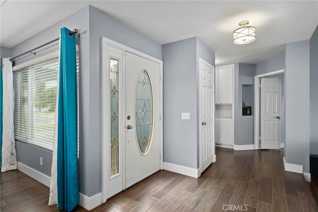5810 Greens Drive Riverside, CA 92509 - Photo 3 of 31 a view of a hallway with wooden floor and closet