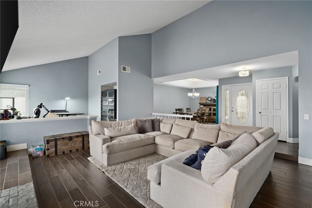 5810 Greens Drive Riverside, CA 92509 - Photo 6 of 31 a living room with furniture and a wooden floor
