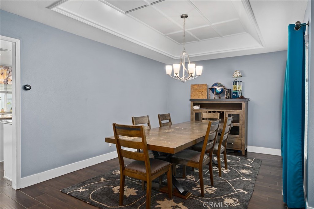 5810 Greens Drive Riverside, CA 92509 - Photo 10 of 31 a view of a dining room with furniture and chandelier