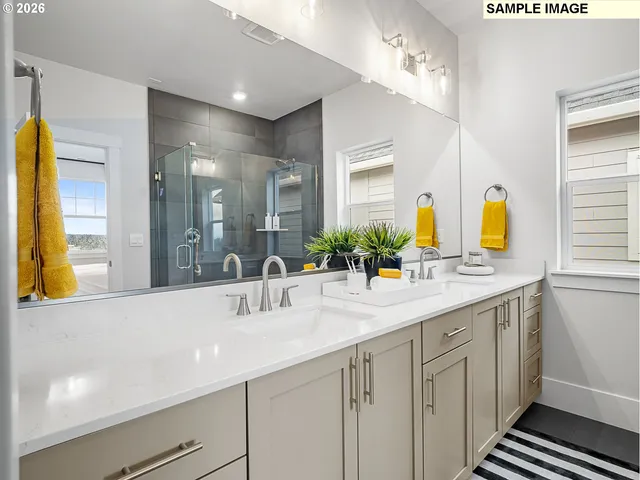a bathroom with a double vanity sink and a mirror