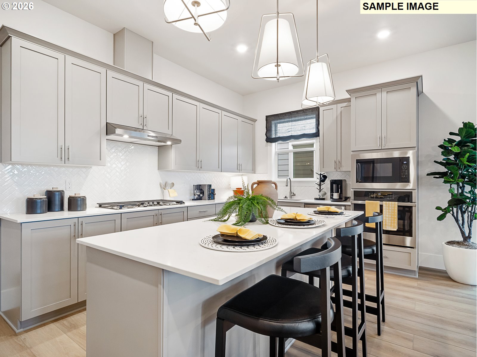 16853 Southwest Pomelo Drive Sherwood, OR 97140 - Photo 27 of 37 a kitchen with granite countertop white cabinets and stainless steel appliances