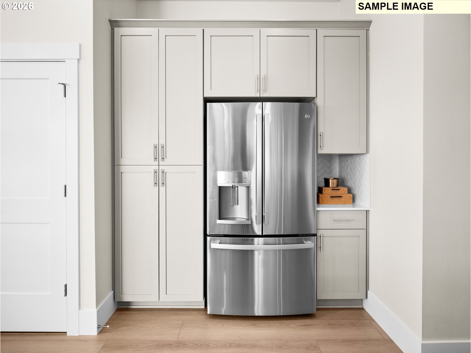 16853 Southwest Pomelo Drive Sherwood, OR 97140 - Photo 33 of 37 a metallic refrigerator freezer sitting in a kitchen