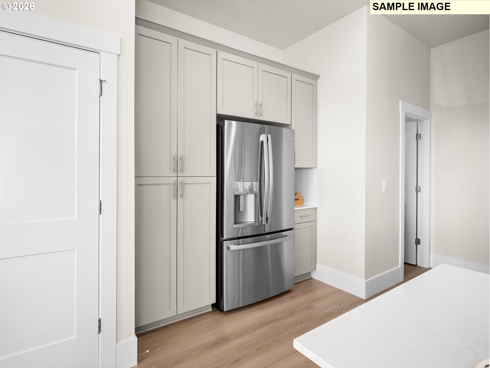 16853 Southwest Pomelo Drive Sherwood, OR 97140 - Photo 35 of 37 a metallic refrigerator freezer sitting in a kitchen