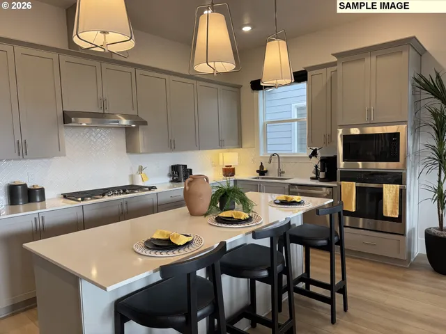 a kitchen with a dining table and chairs