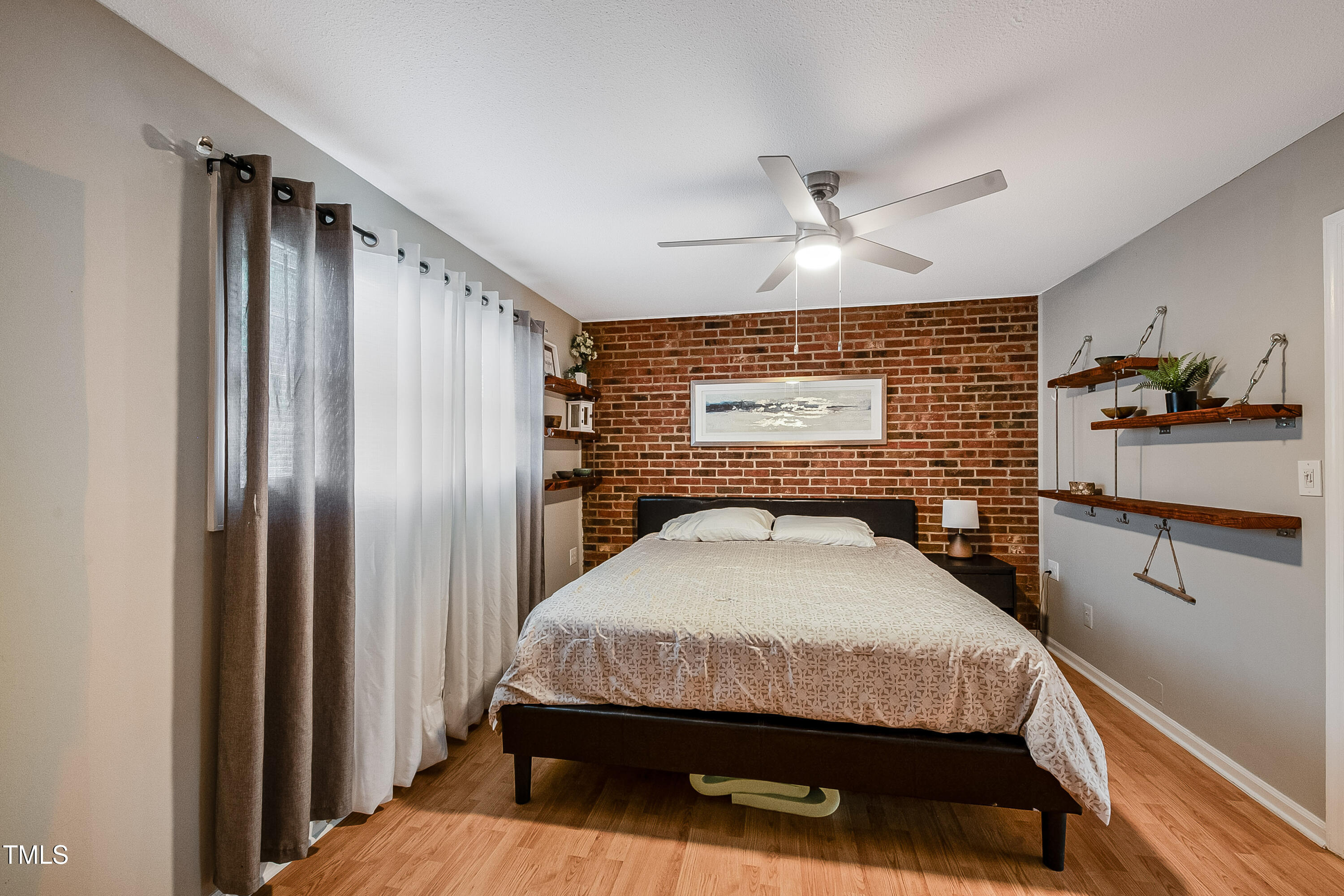 807 West Trinity Avenue, Unit 232 Durham, NC 27701 - Photo 13 of 26 a bedroom with a bed dresser and a window