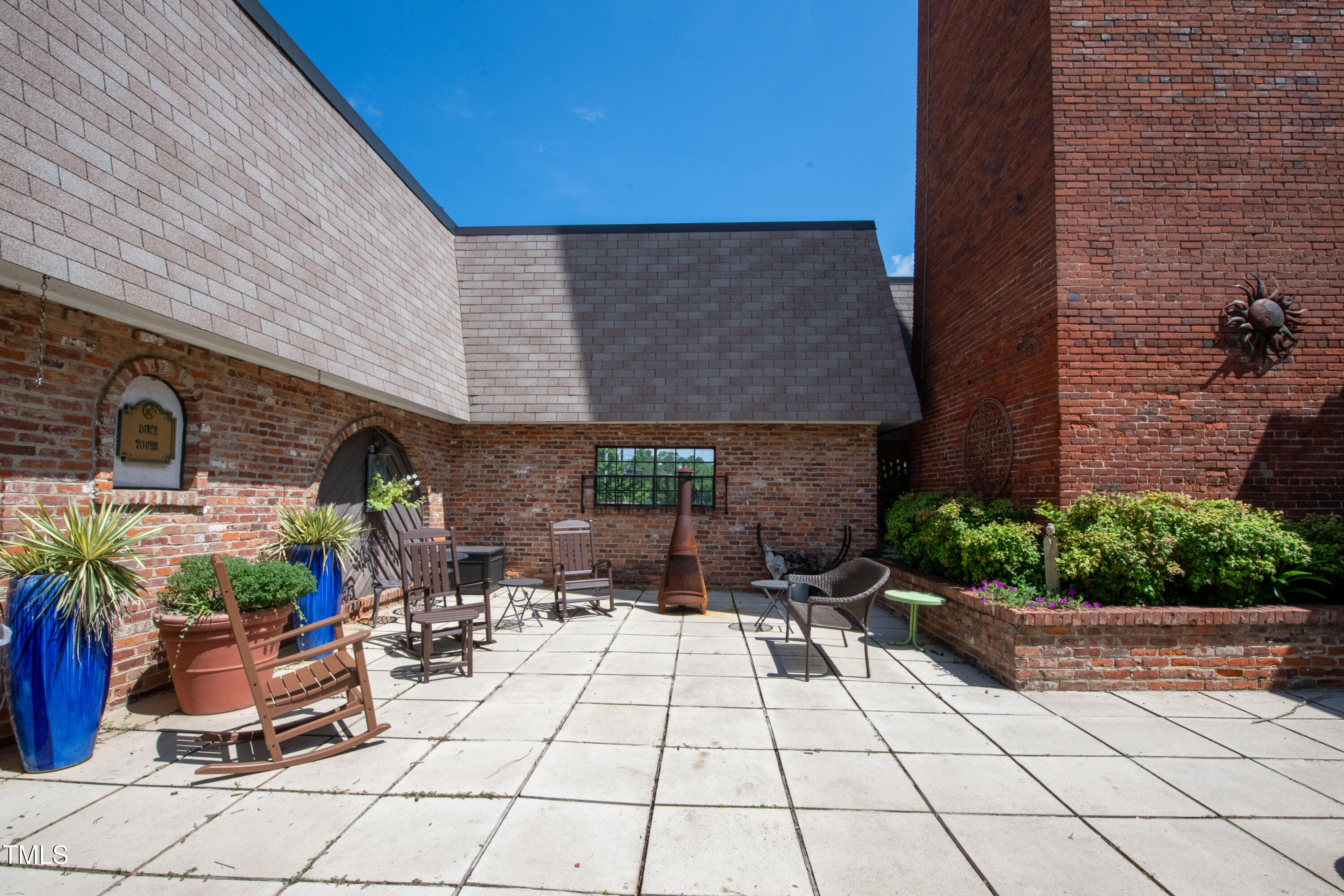 807 West Trinity Avenue, Unit 232 Durham, NC 27701 - Photo 20 of 26 a view of house with patio outdoor seating and plants