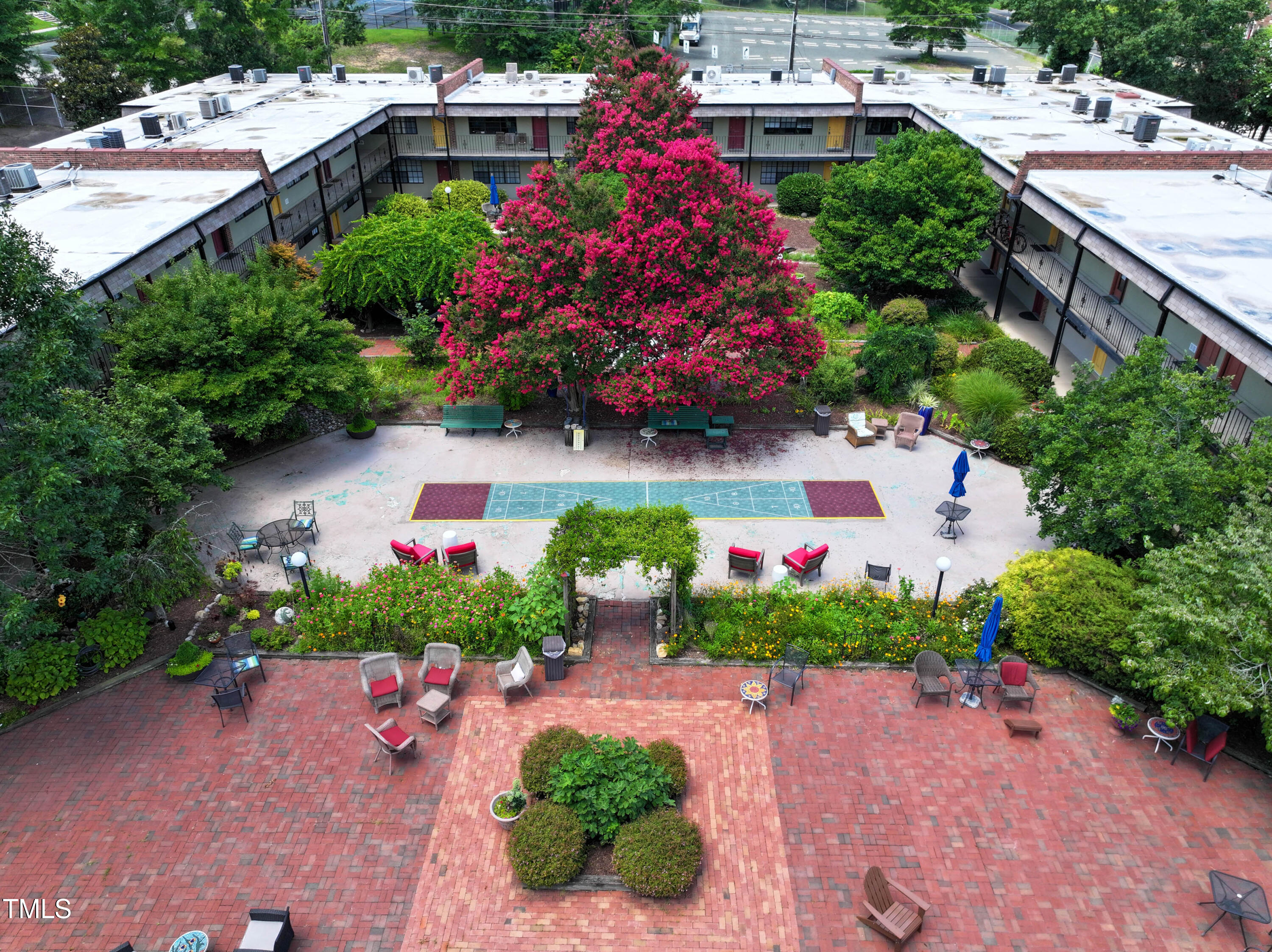 807 West Trinity Avenue, Unit 232 Durham, NC 27701 - Photo 23 of 26 a aerial view of a house with a yard and garden