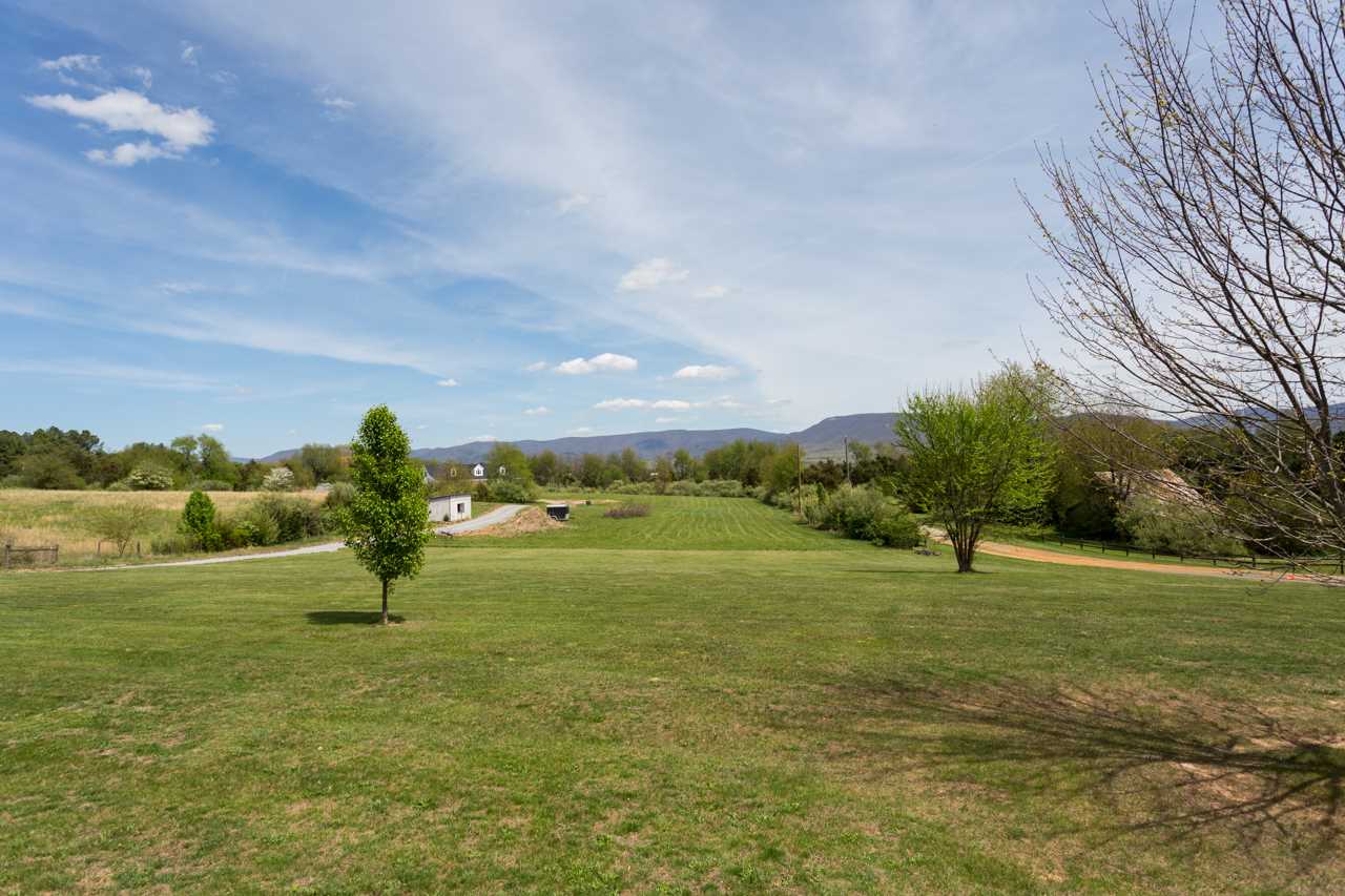 695 Brower Road Waynesboro, VA 22980 - Photo 38 of 50 a view of a golf course with a lake