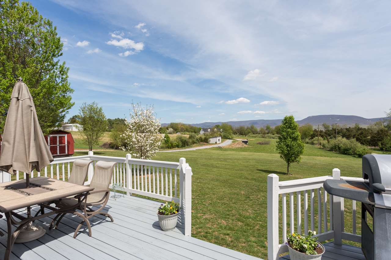 695 Brower Road Waynesboro, VA 22980 - Photo 42 of 50 a view of a balcony with two chairs and a table