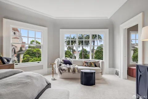 a white bath tub sitting next to a window