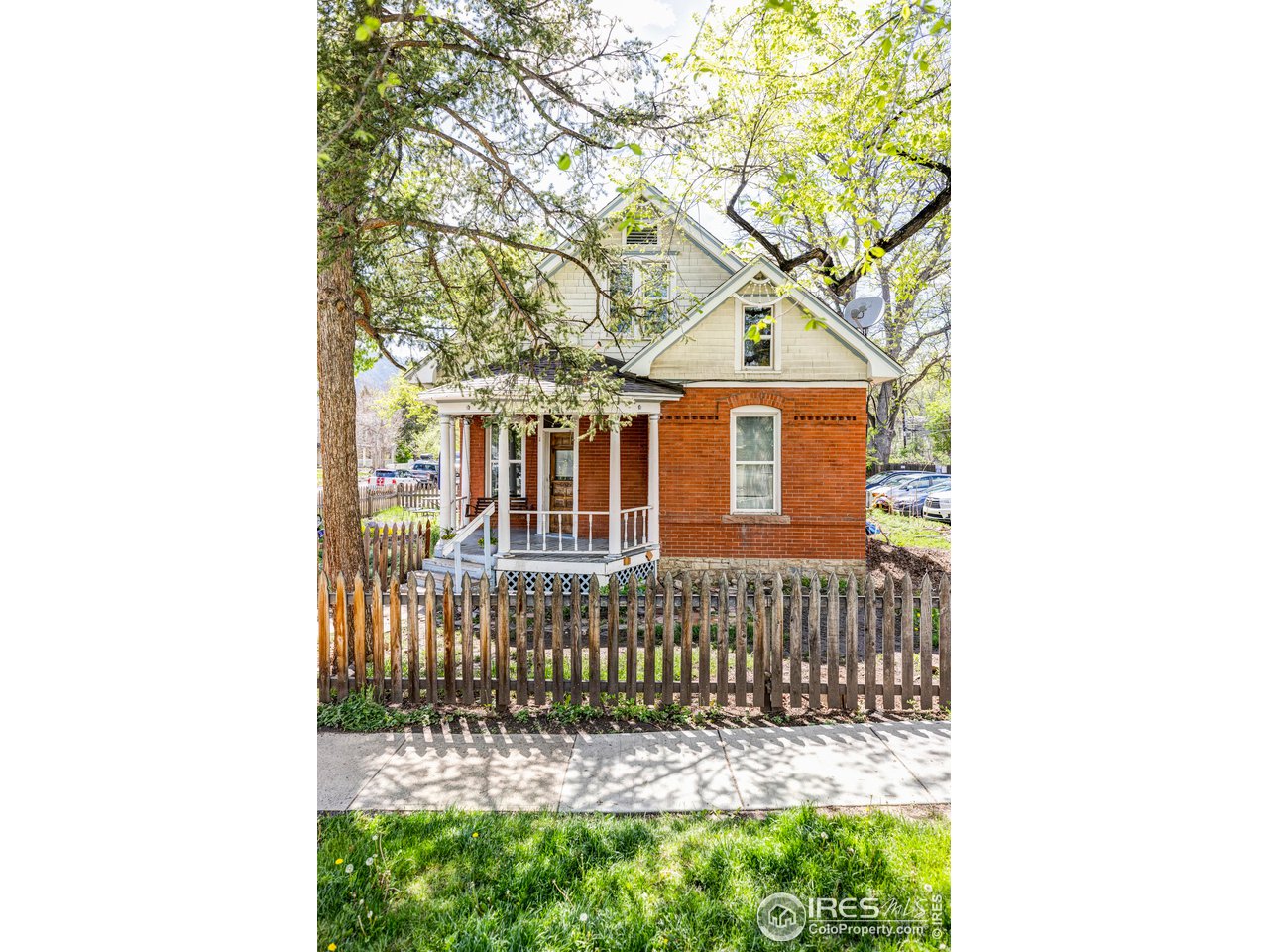 a front view of a house with a small yard