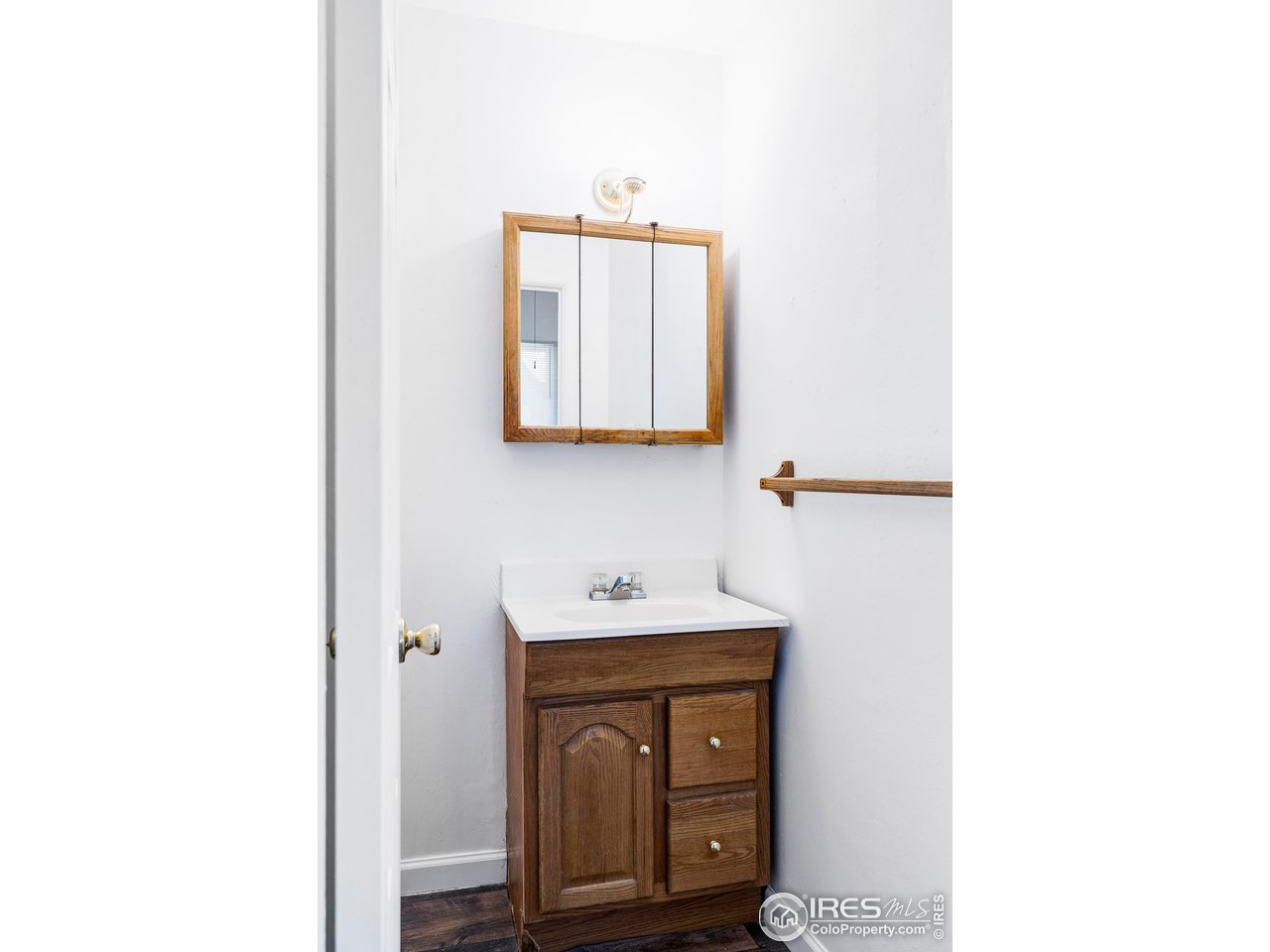 1843 Grove Street Boulder, CO 80302 - Photo 15 of 16 a bathroom with a sink a mirror and vanity