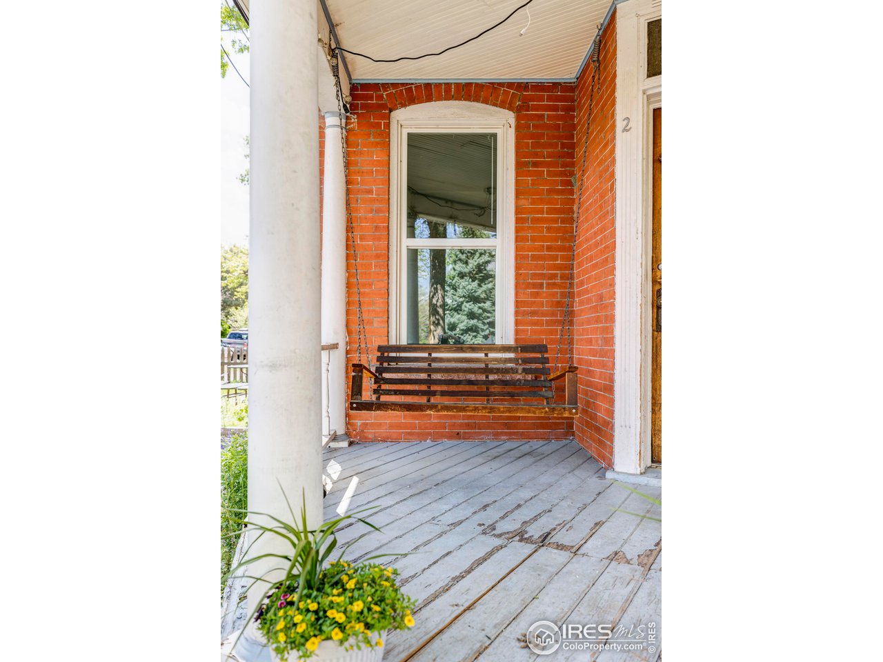 1843 Grove Street Boulder, CO 80302 - Photo 4 of 16 a view of a room with a window and a potted plant