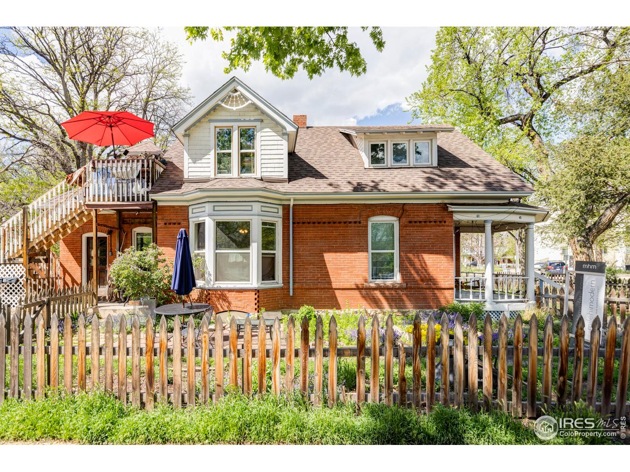 1843 Grove Street Boulder, CO 80302 - Photo 7 of 16 a front view of a house with a yard