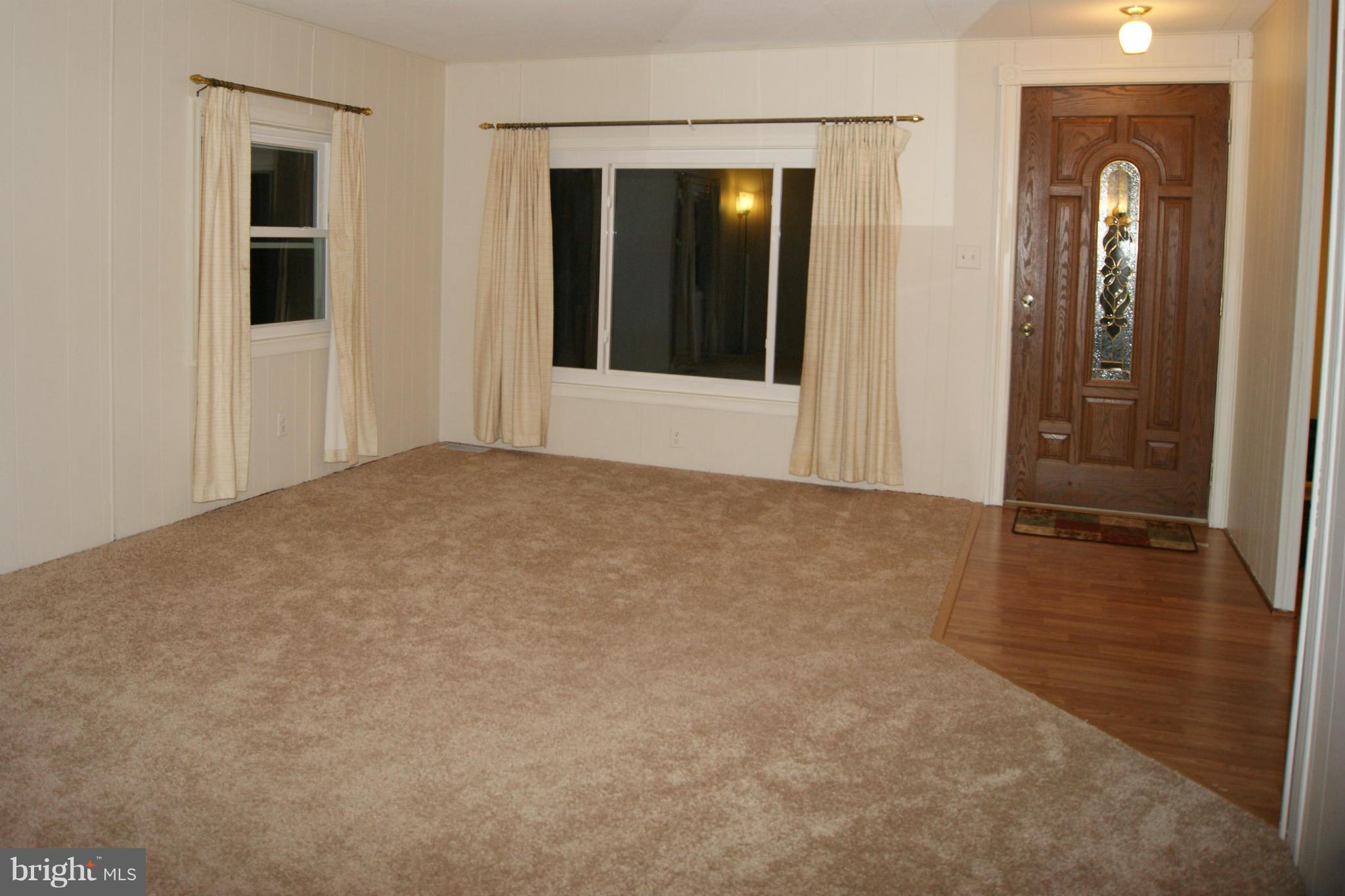 6805 Mackall Road St. Leonard, MD 20685 - Photo 28 of 30 an empty room with windows and closet