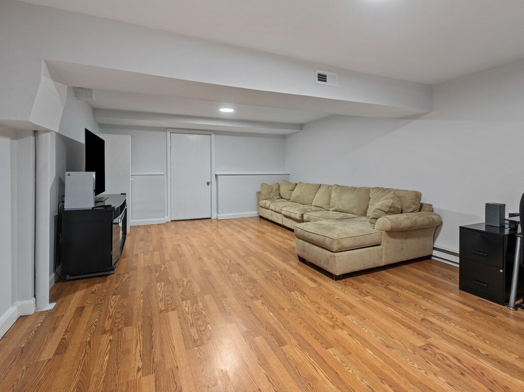 2 Stringer Dam Road Shrewsbury, MA 01545 - Photo 18 of 35 a living room with furniture and a flat screen tv
