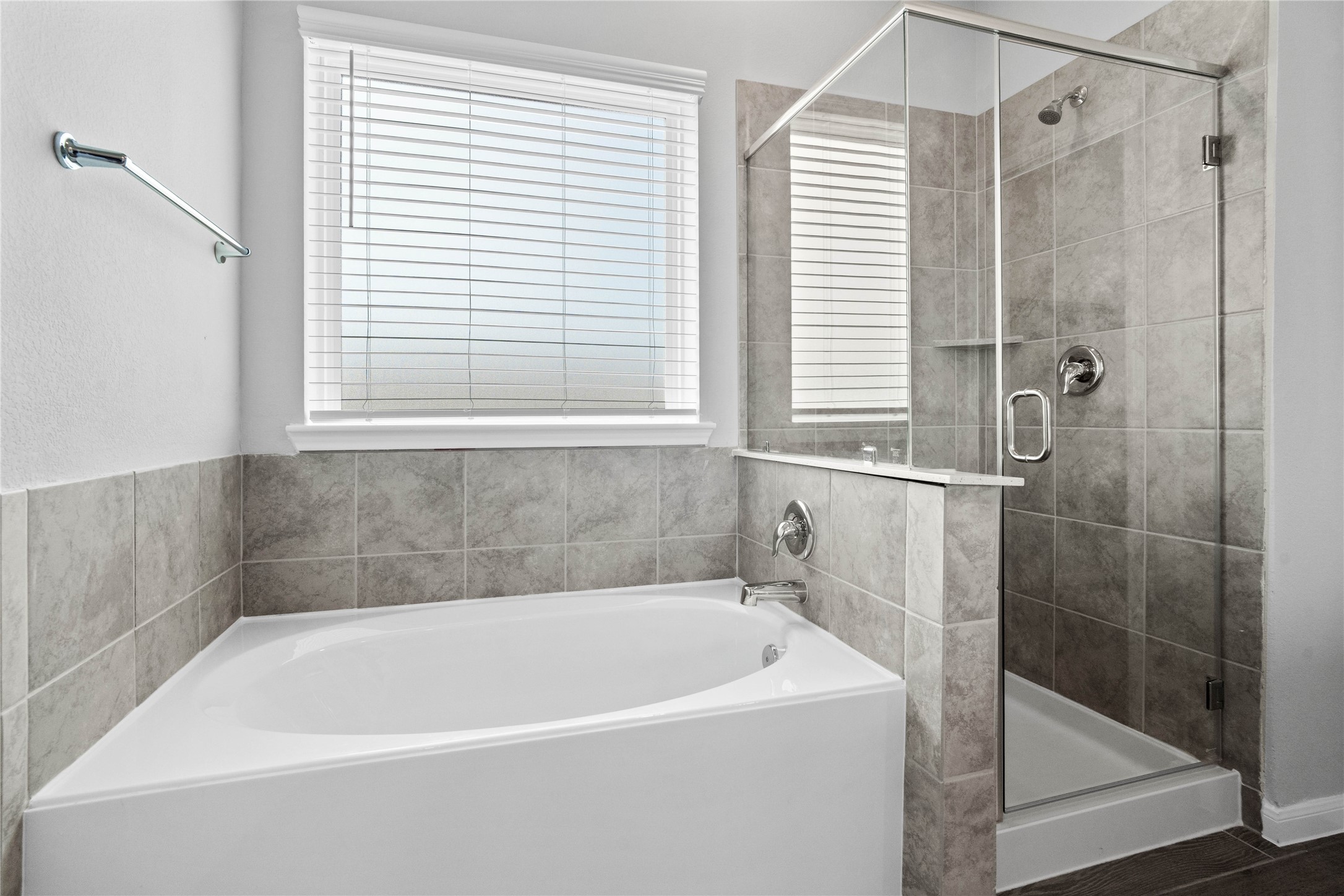 19657 Montgomery Rdg Way Montgomery, TX 77316 - Photo 30 of 49 Additional view of the primary bathroom showcases the soaking tub and walk-in shower with window allowing in natural lighting.