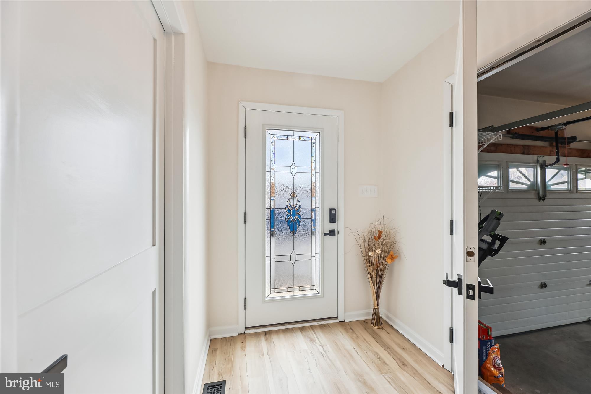16130 Inheritance Drive Brandywine, MD 20613 - Photo 14 of 39 a view of a hallway with wooden floor and a living room