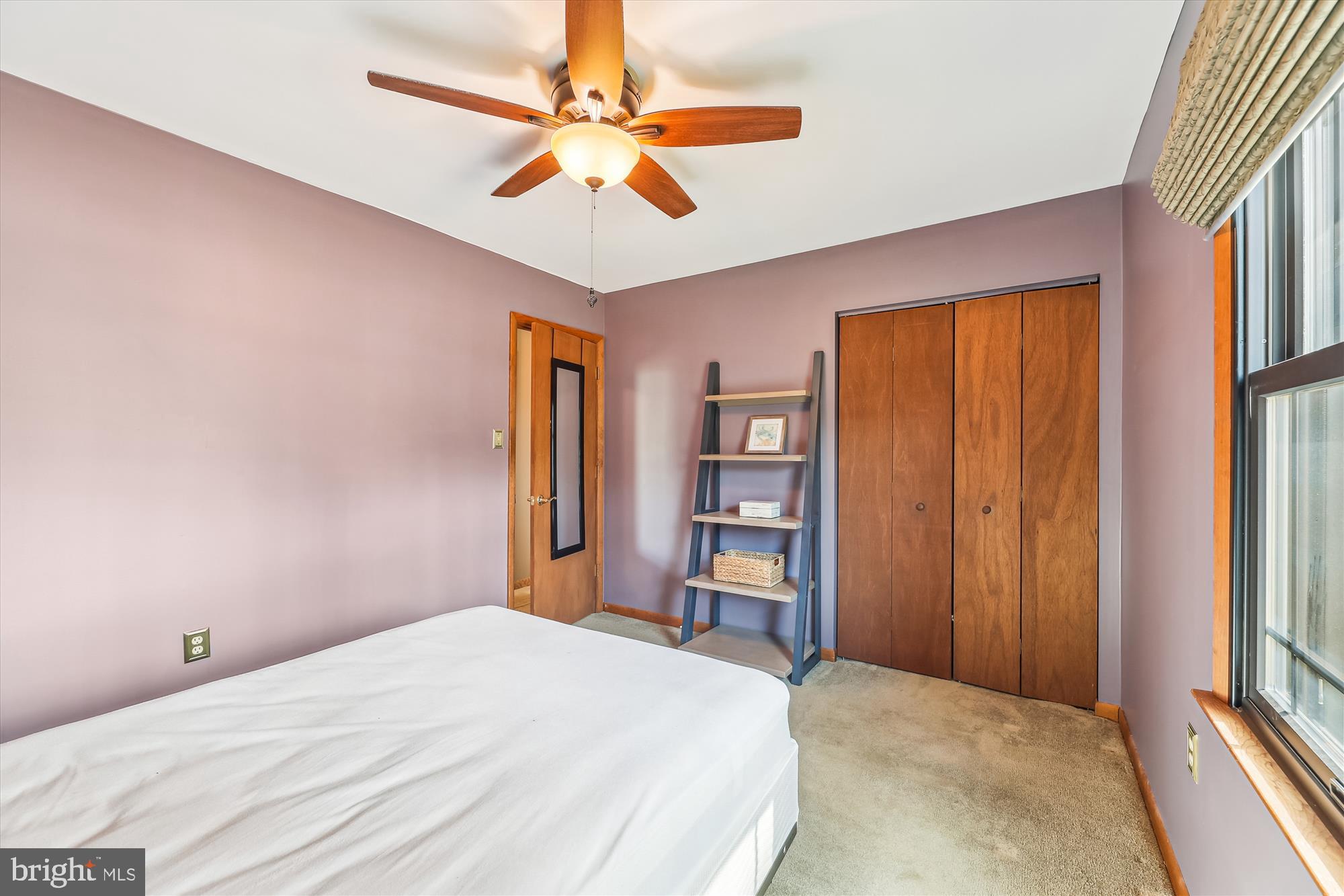16130 Inheritance Drive Brandywine, MD 20613 - Photo 16 of 39 a bedroom with a large bed and a chandelier