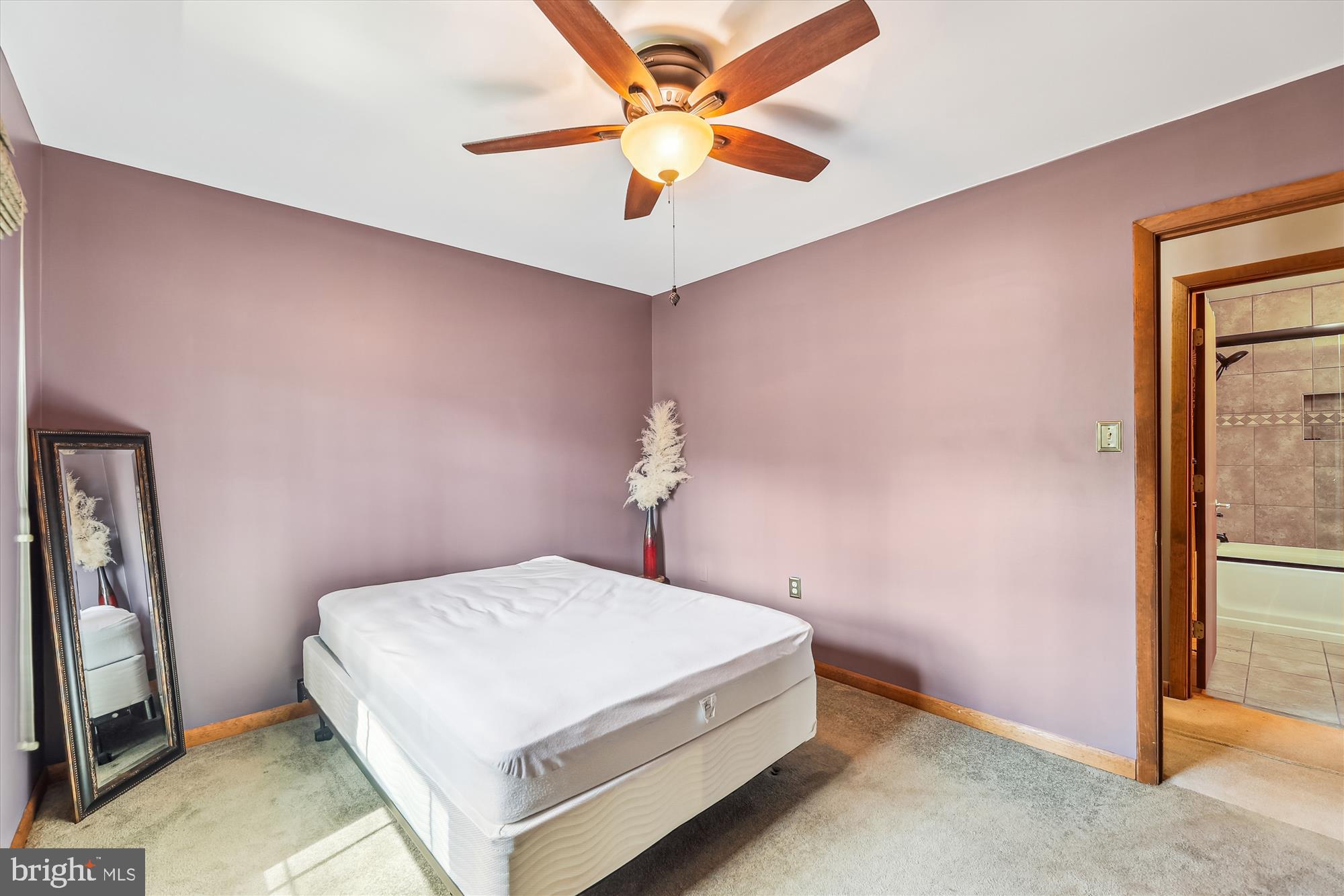 16130 Inheritance Drive Brandywine, MD 20613 - Photo 17 of 39 a bedroom with a bed and a ceiling fan