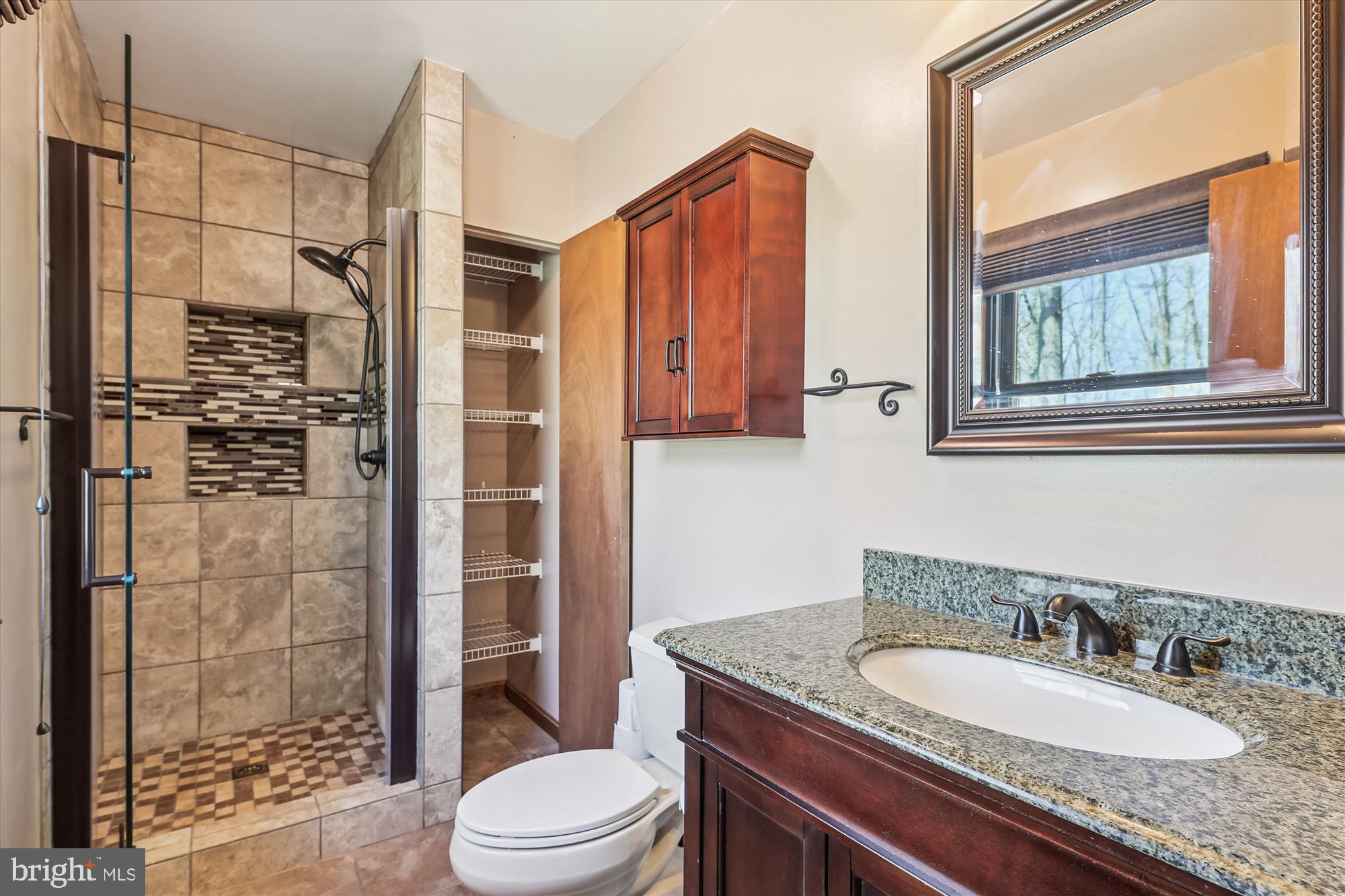 16130 Inheritance Drive Brandywine, MD 20613 - Photo 25 of 39 a bathroom with a granite countertop sink toilet a mirror and shower